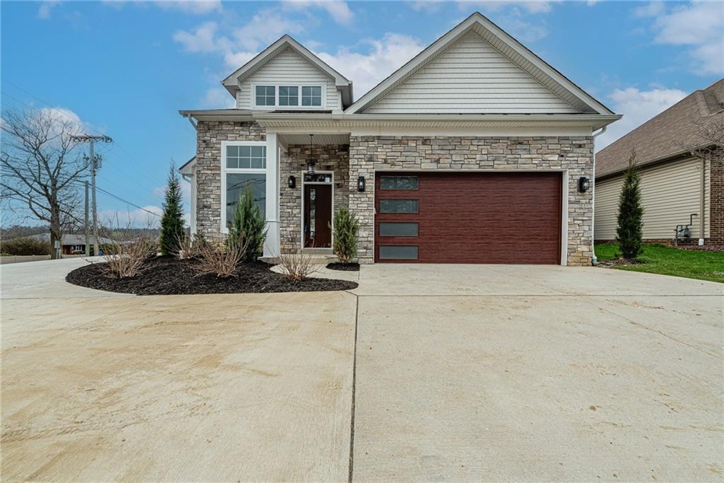 a front view of a house with garage