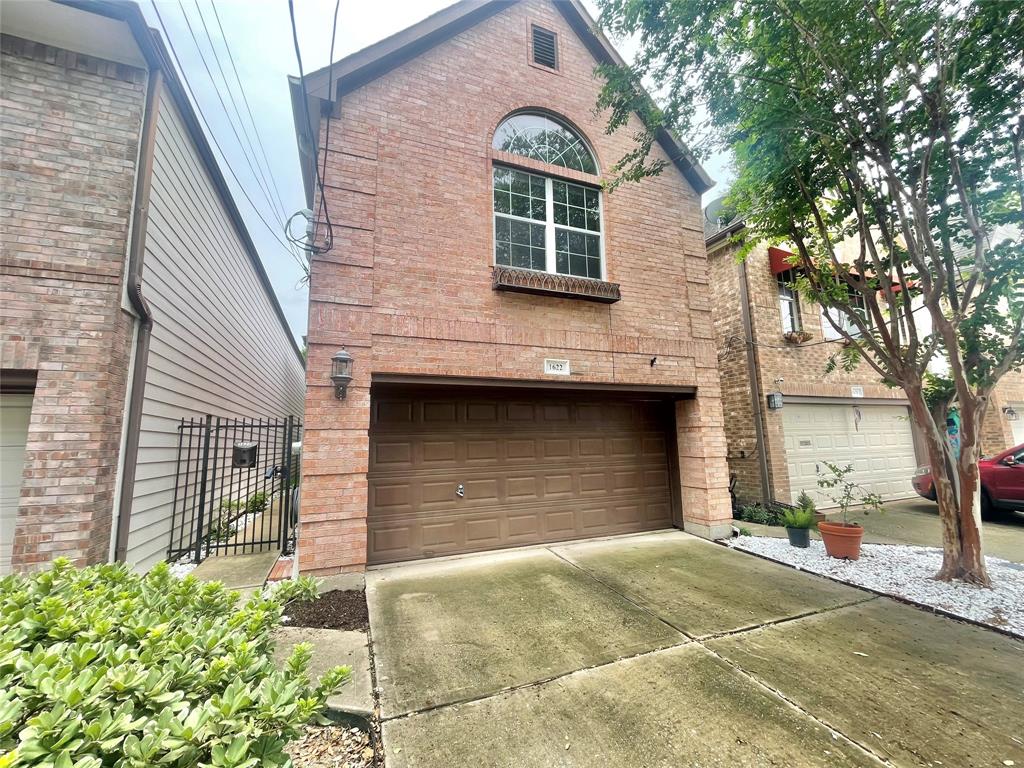 a front view of a house with a garage