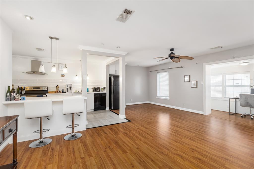 a view of kitchen with cabinets and wooden floor