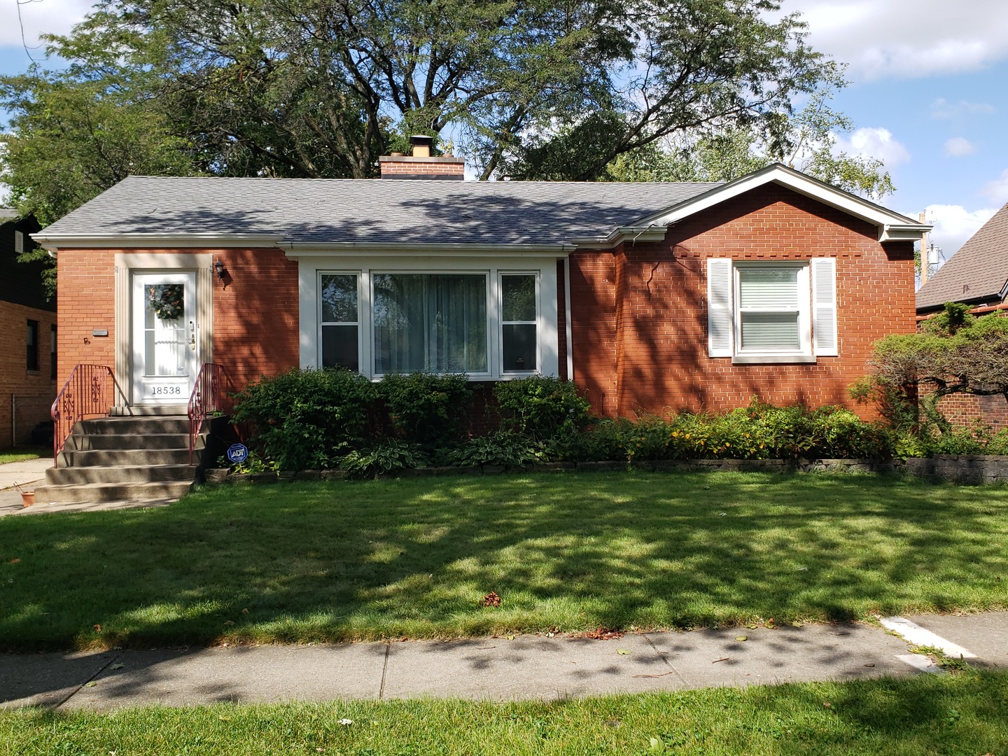 front view of a house with a yard