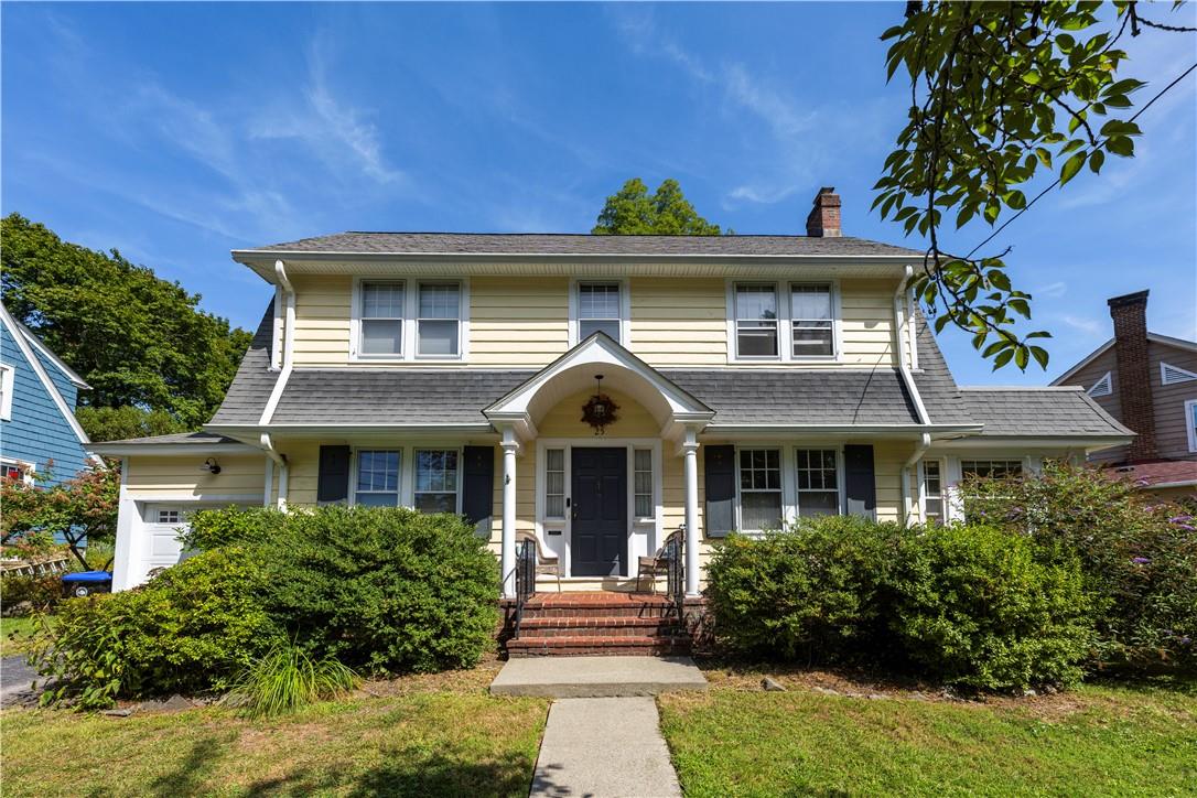 a front view of a house with a yard