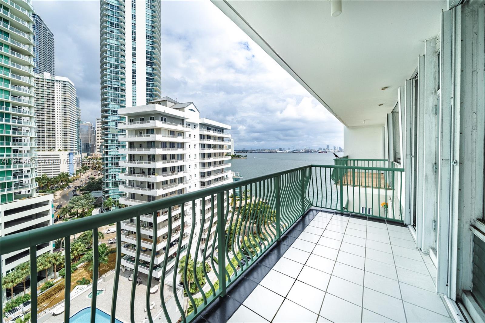 a view of a balcony with wooden floor