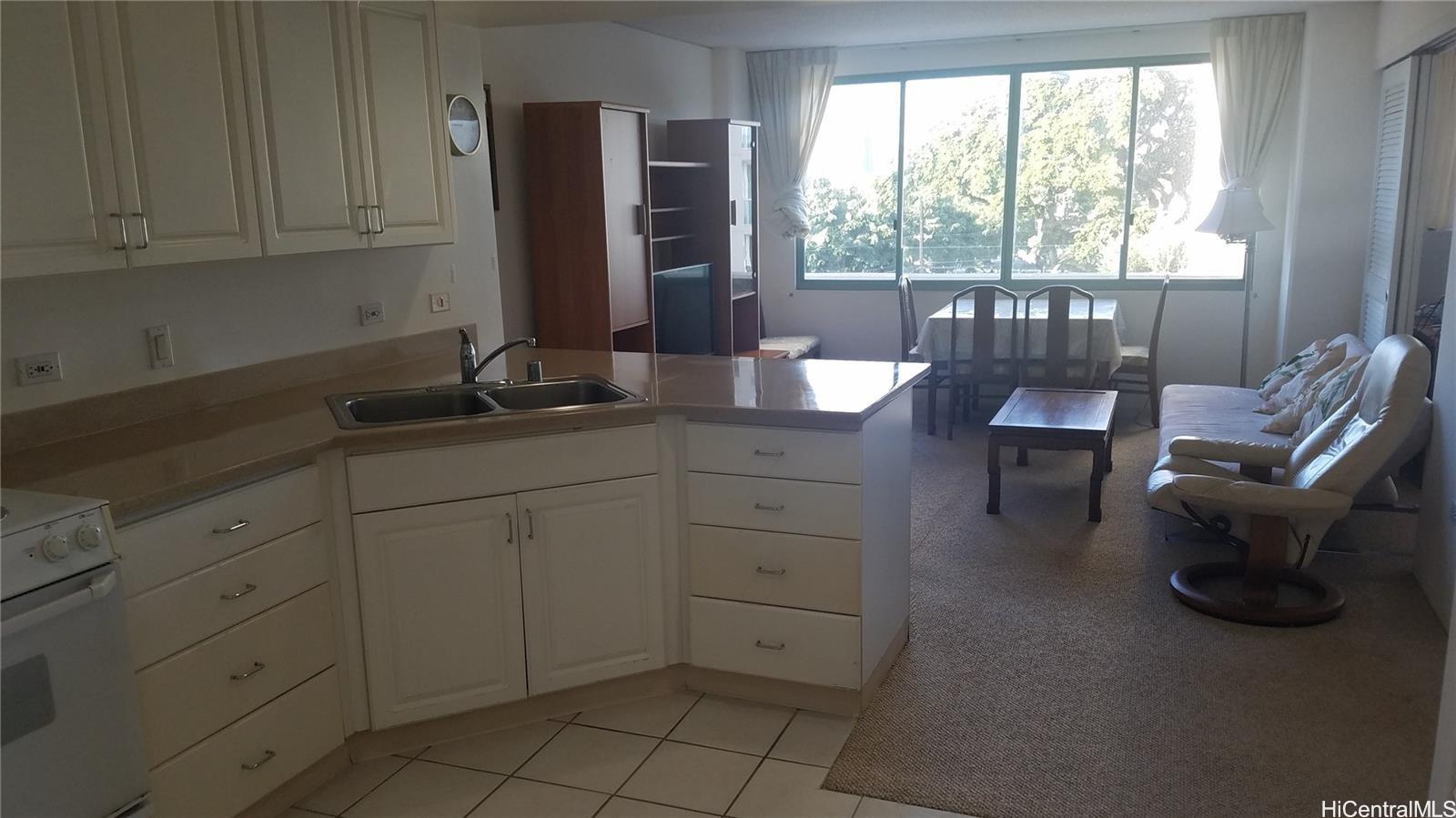 a kitchen with sink cabinets and window