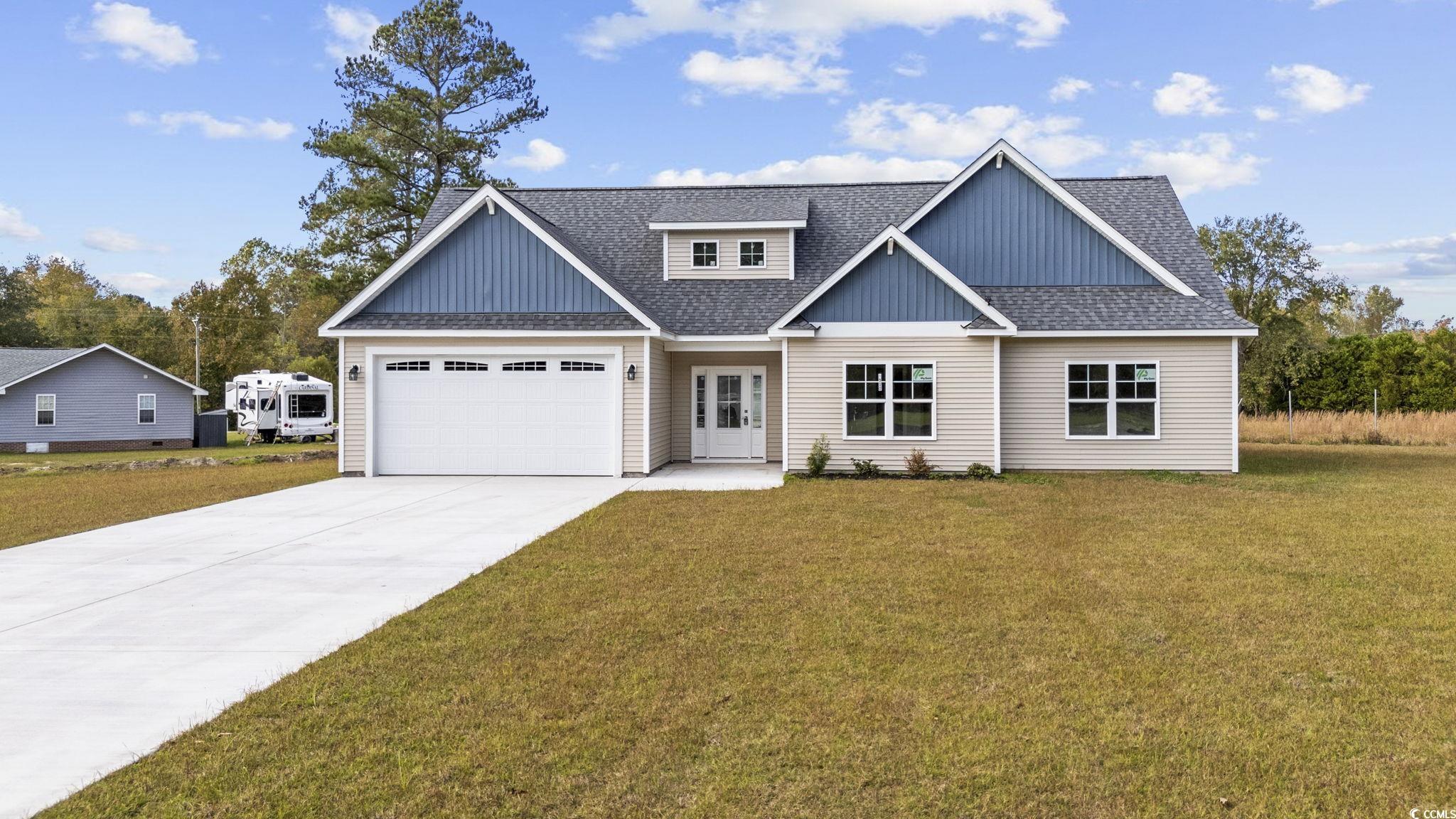 Craftsman-style home featuring a front lawn and a