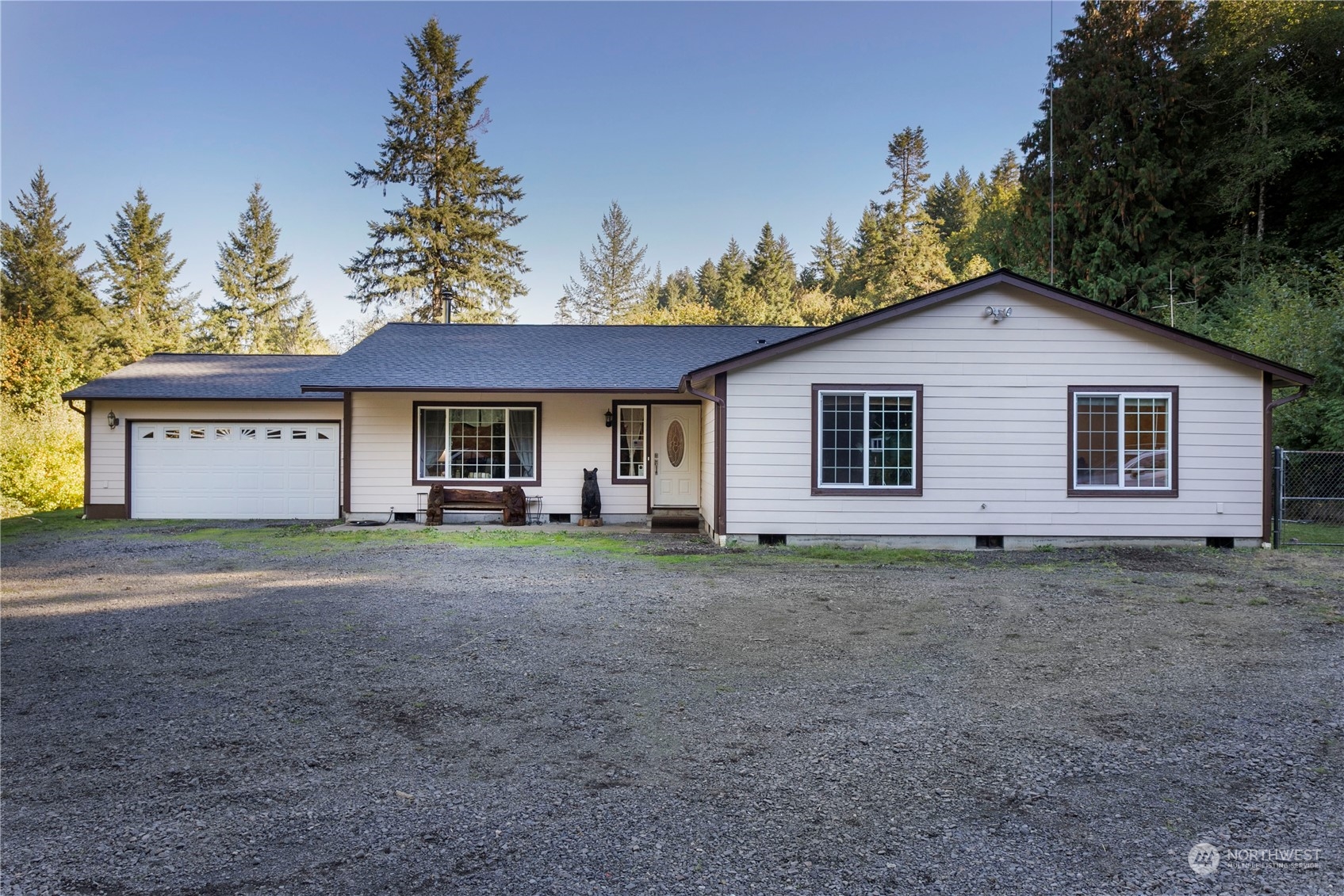 a view of a house with a yard and a garage