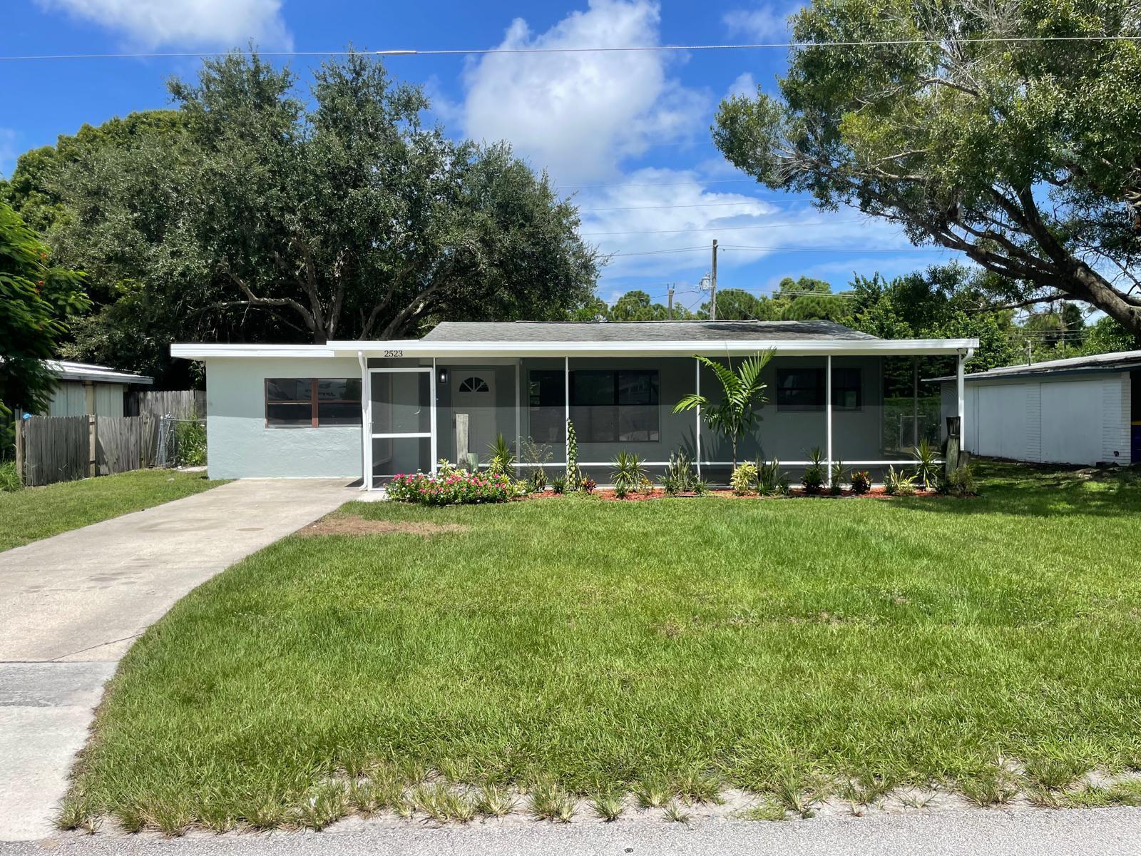 front view of a house with a yard