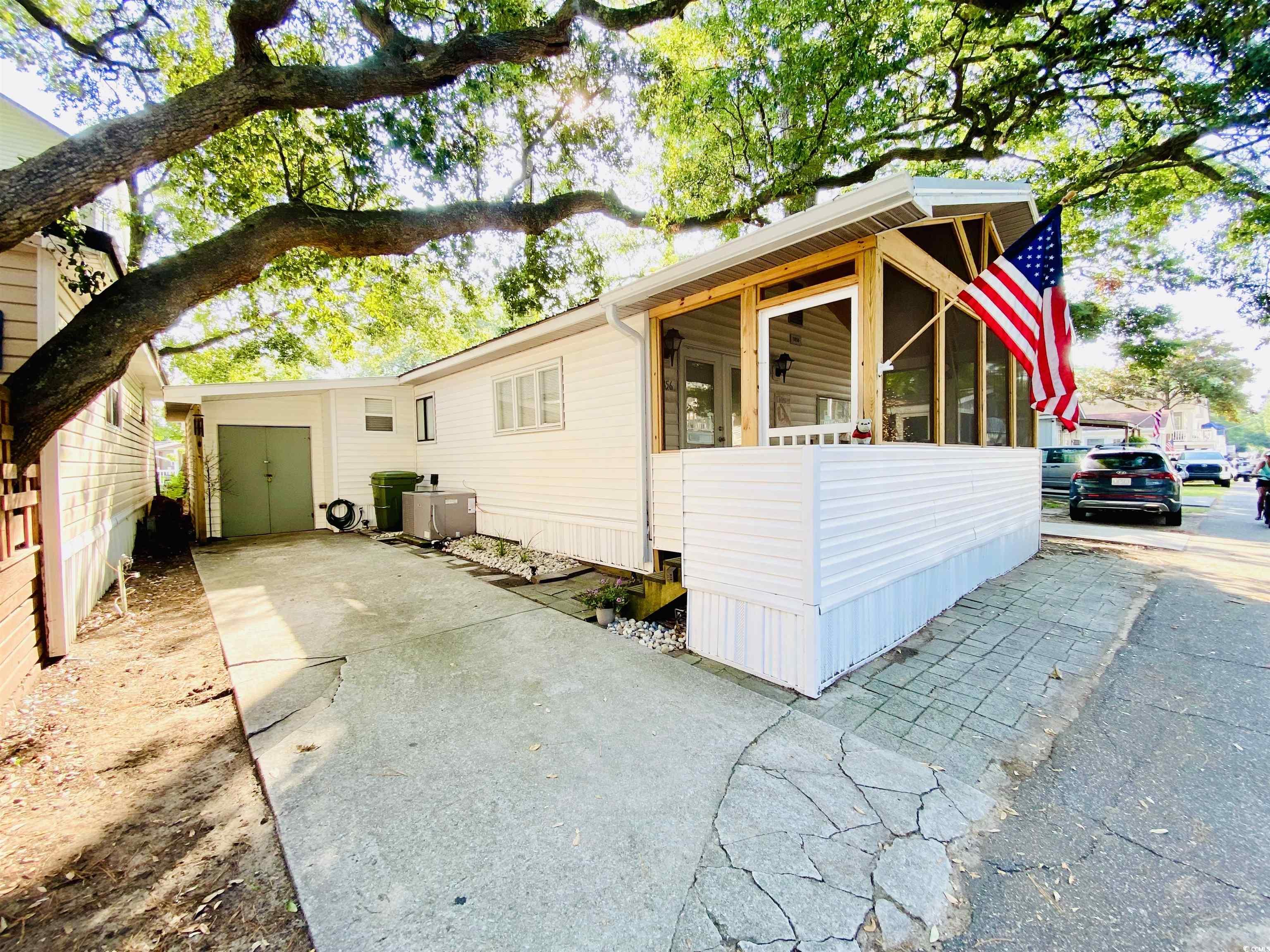 View of driveway and side of home