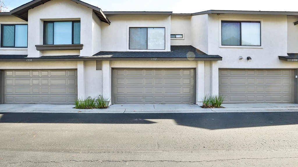 a front view of a house with garage