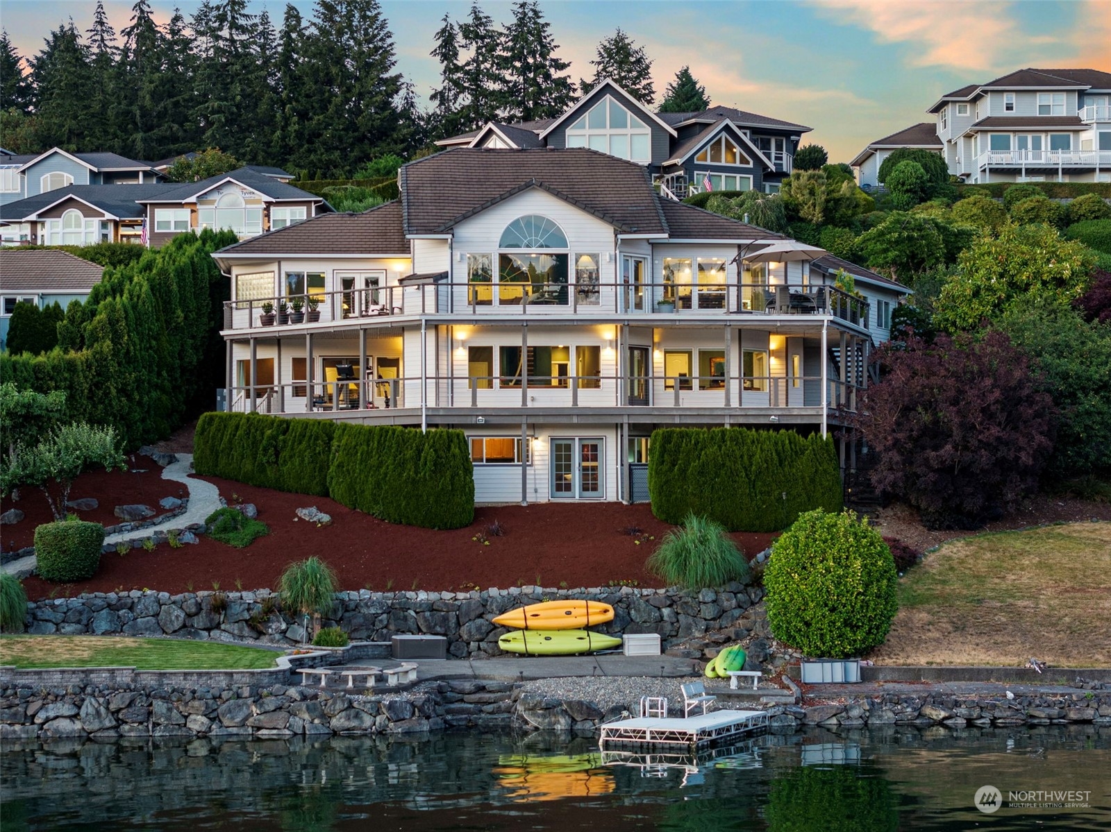 a aerial view of a house with a yard and outdoor seating