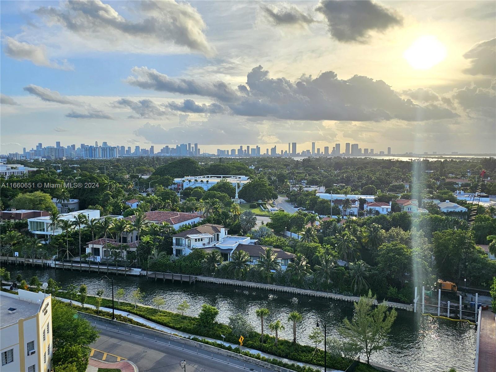 an aerial view of residential houses with lake view