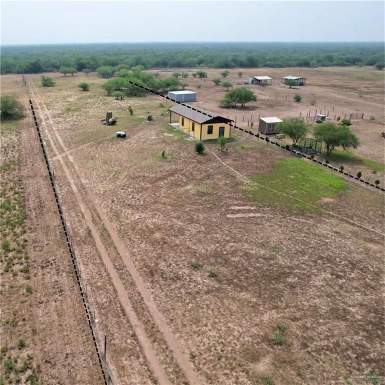 Birds eye view of property featuring a rural view