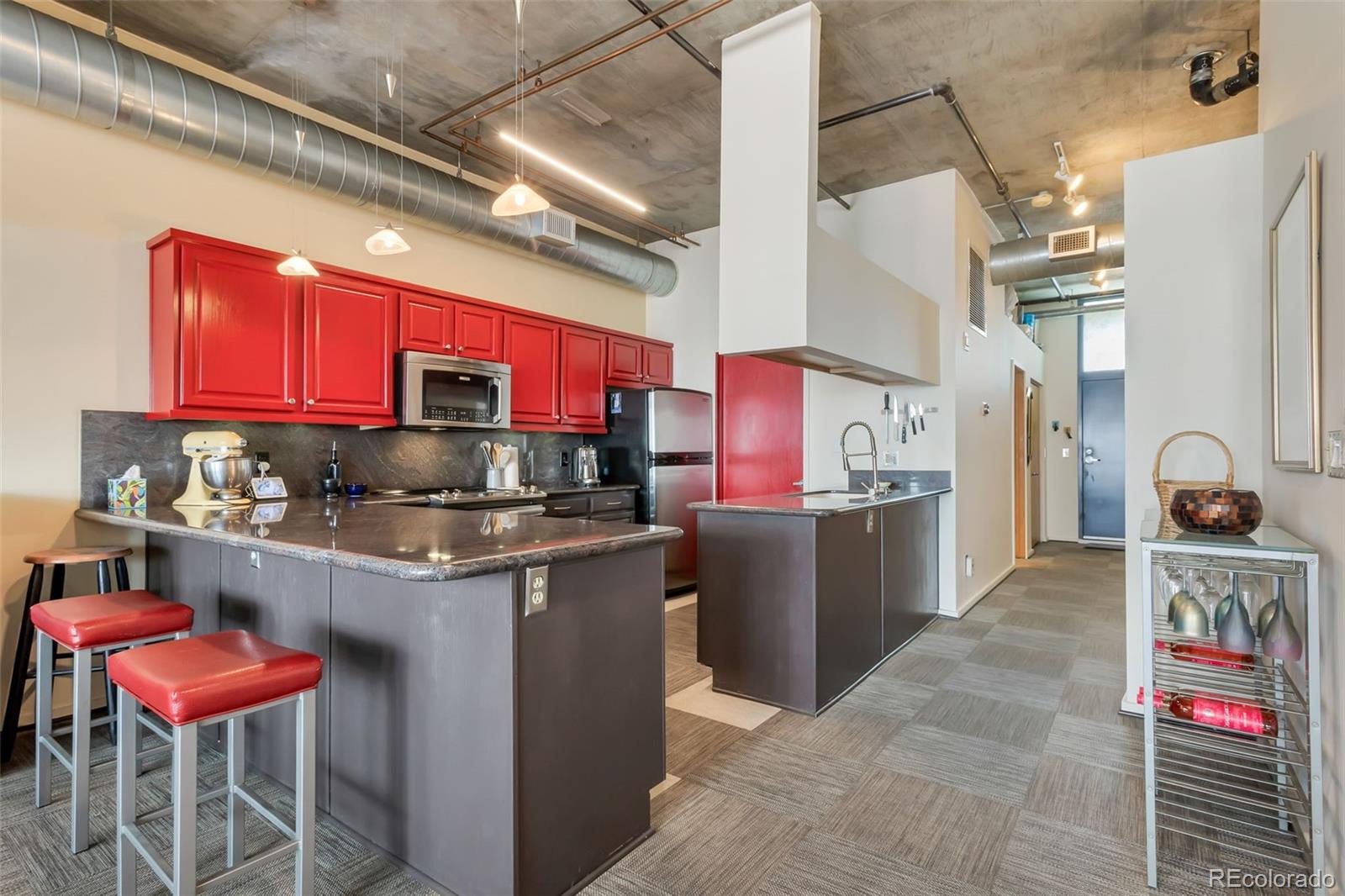 a kitchen with stainless steel appliances granite countertop a sink and cabinets