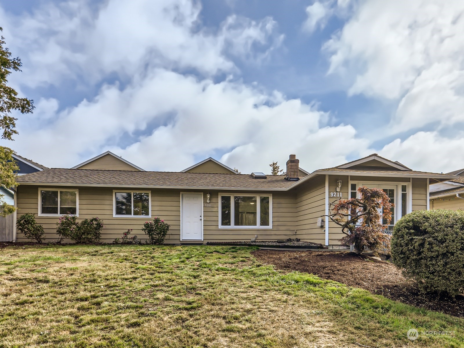 a front view of a house with garden