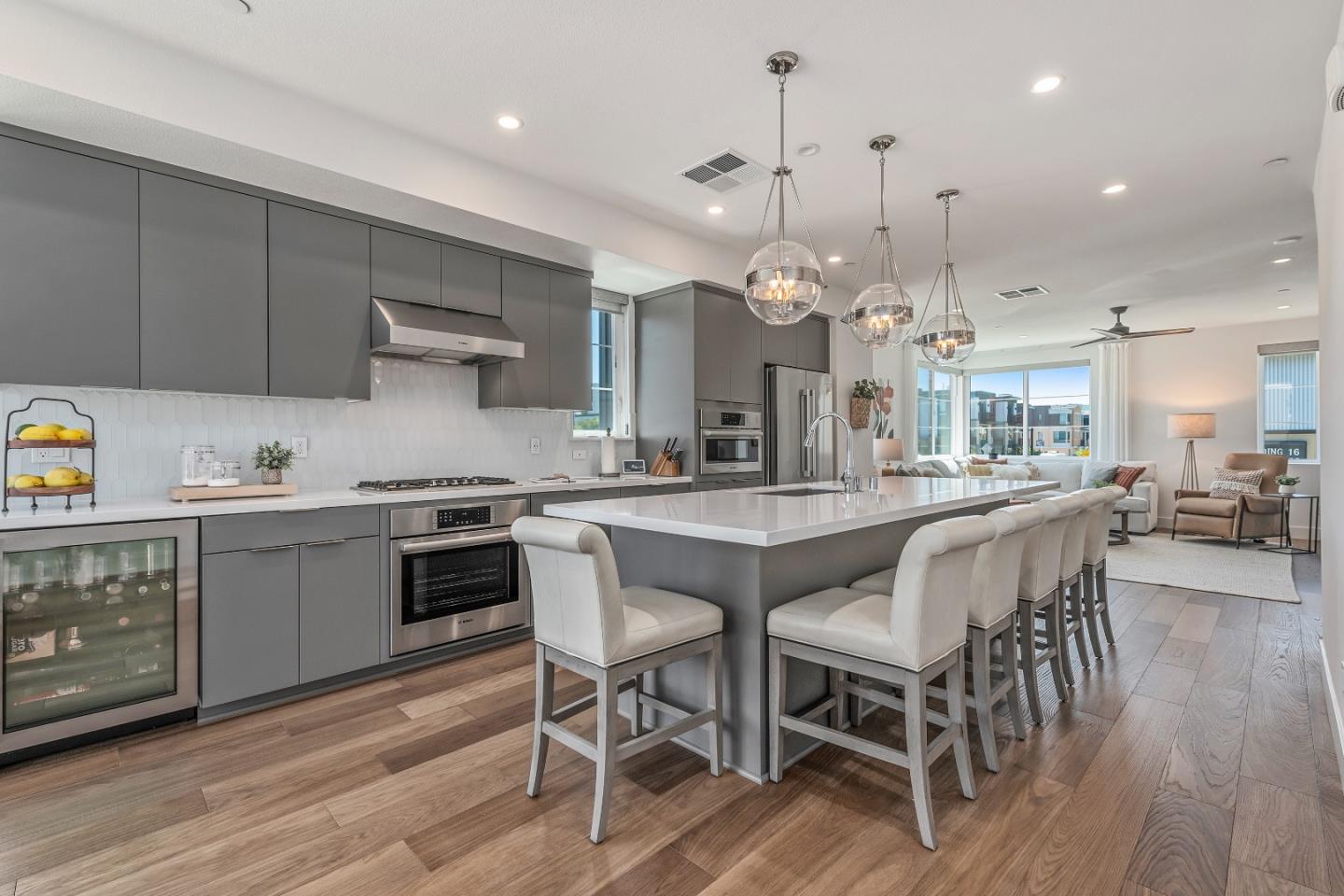 a large kitchen with a table and chairs