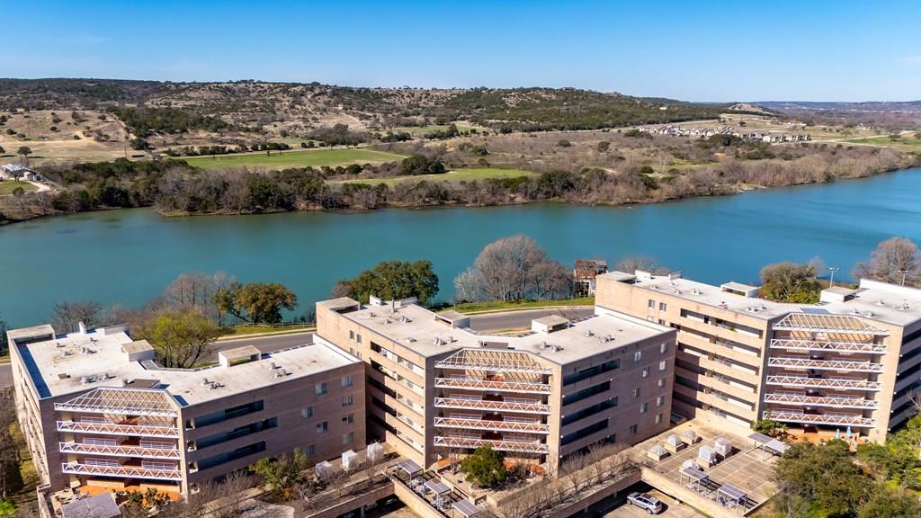 an aerial view of a house with a lake view