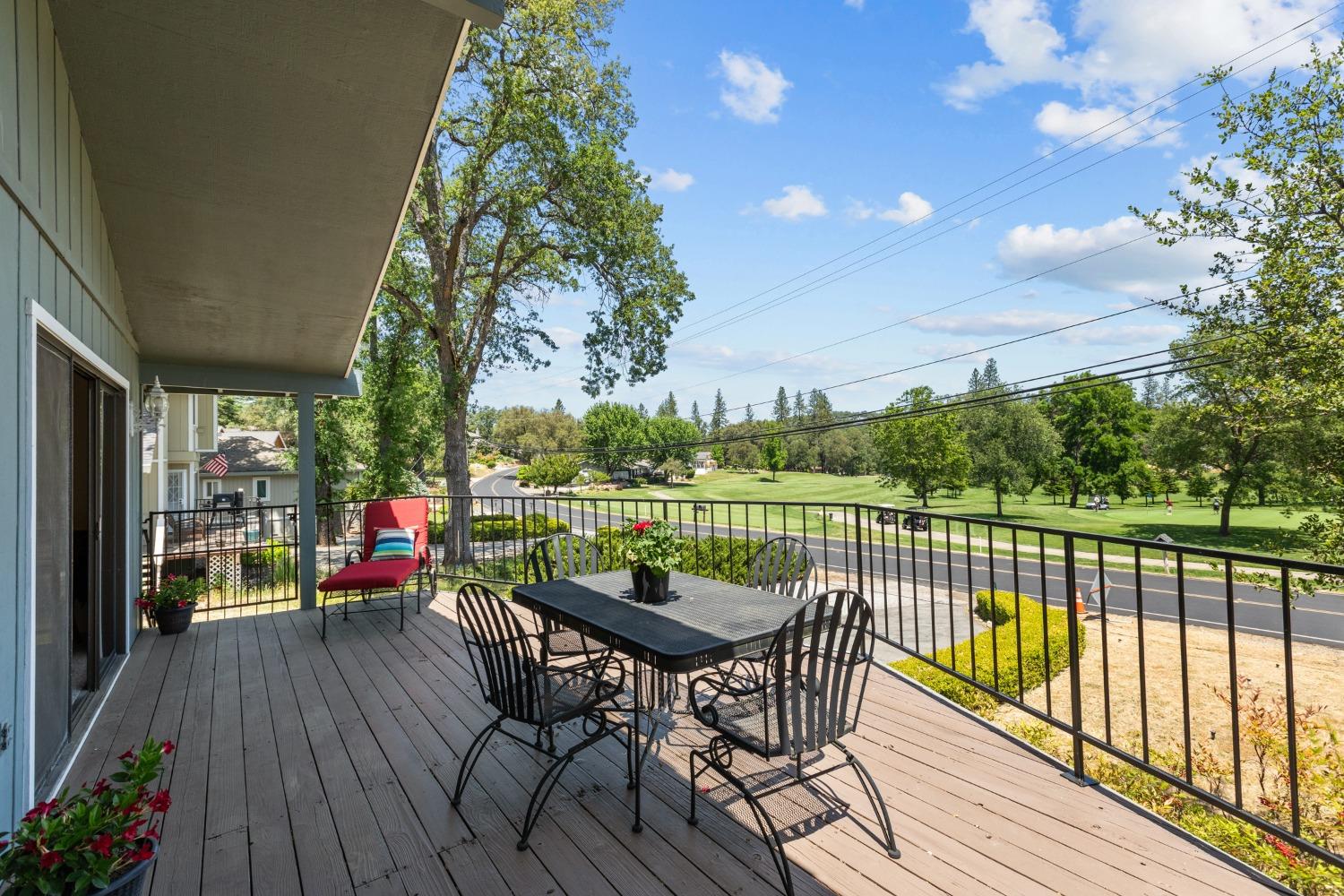 a view of balcony with furniture and wooden floor