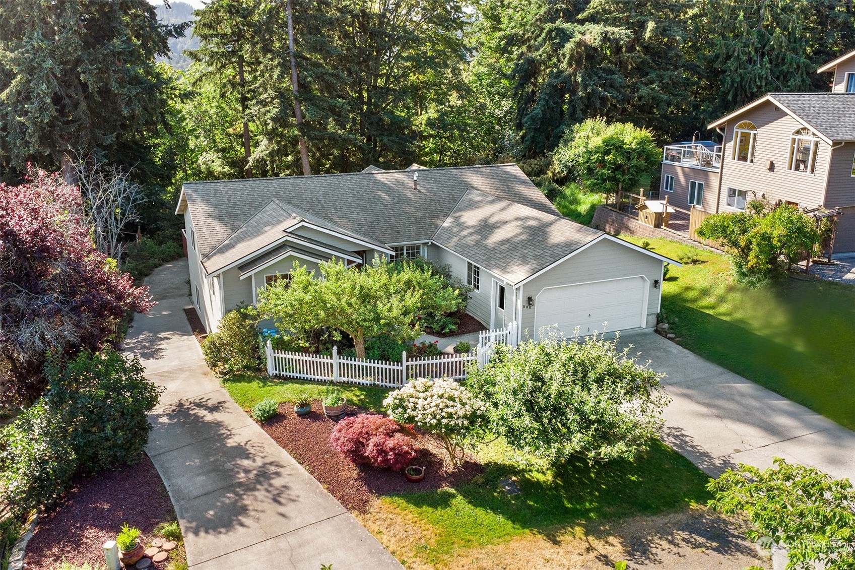 an aerial view of a house with a garden