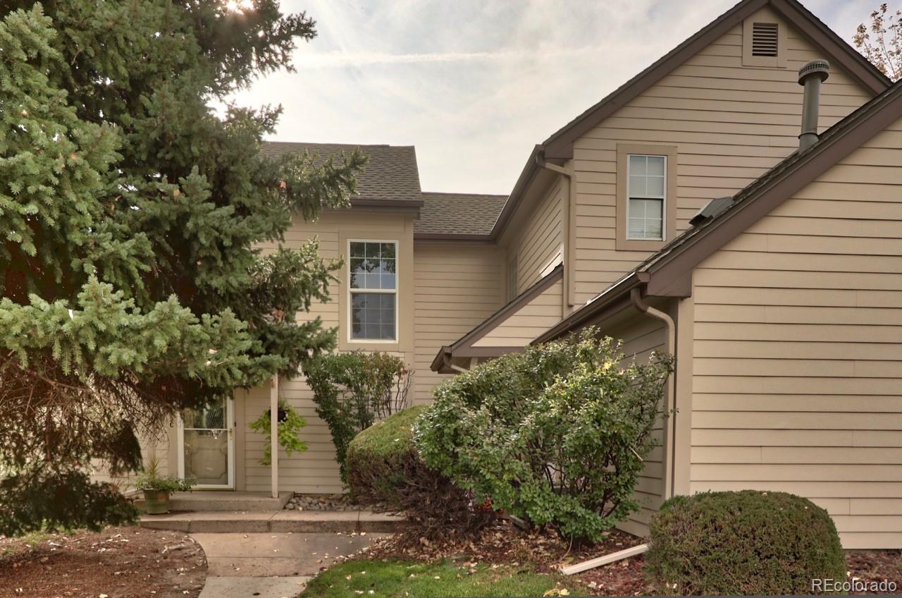 a view of a house with a tree