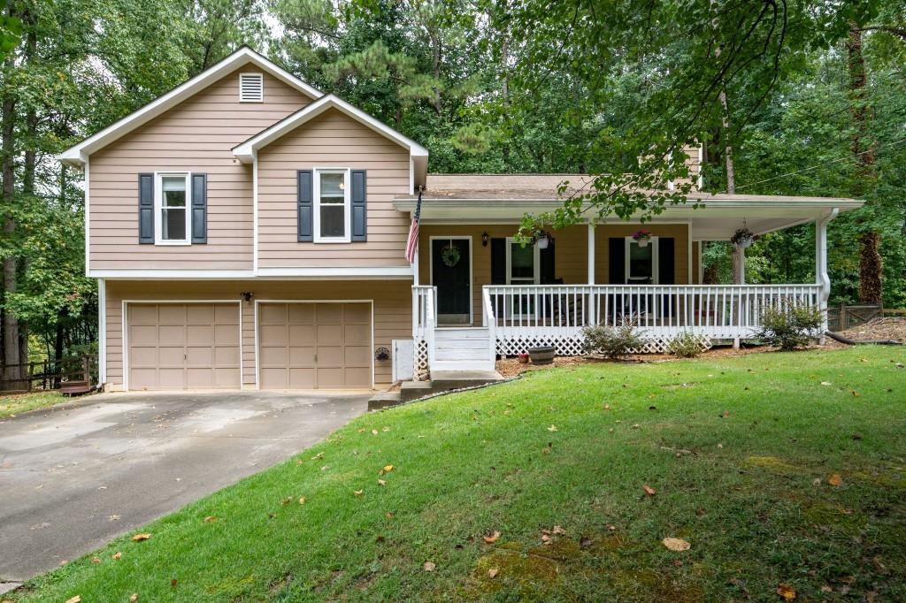 a front view of a house with yard