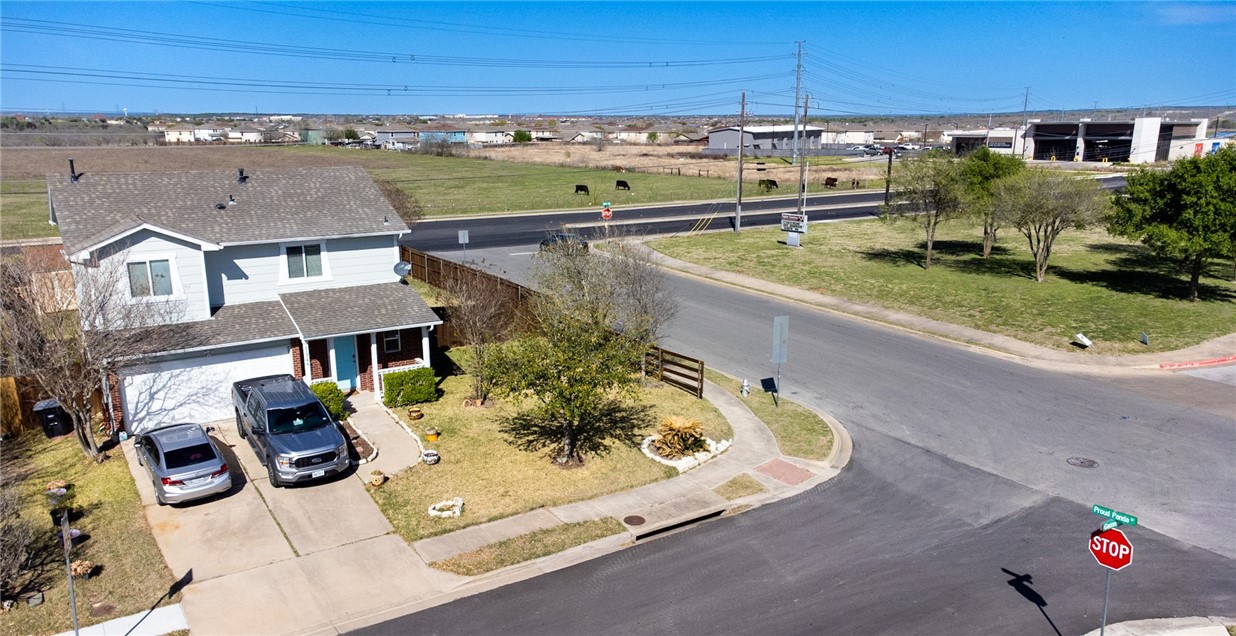 an aerial view of residential houses with outdoor space