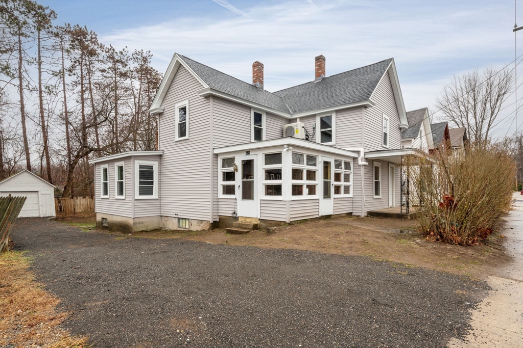 a front view of a house with a large window