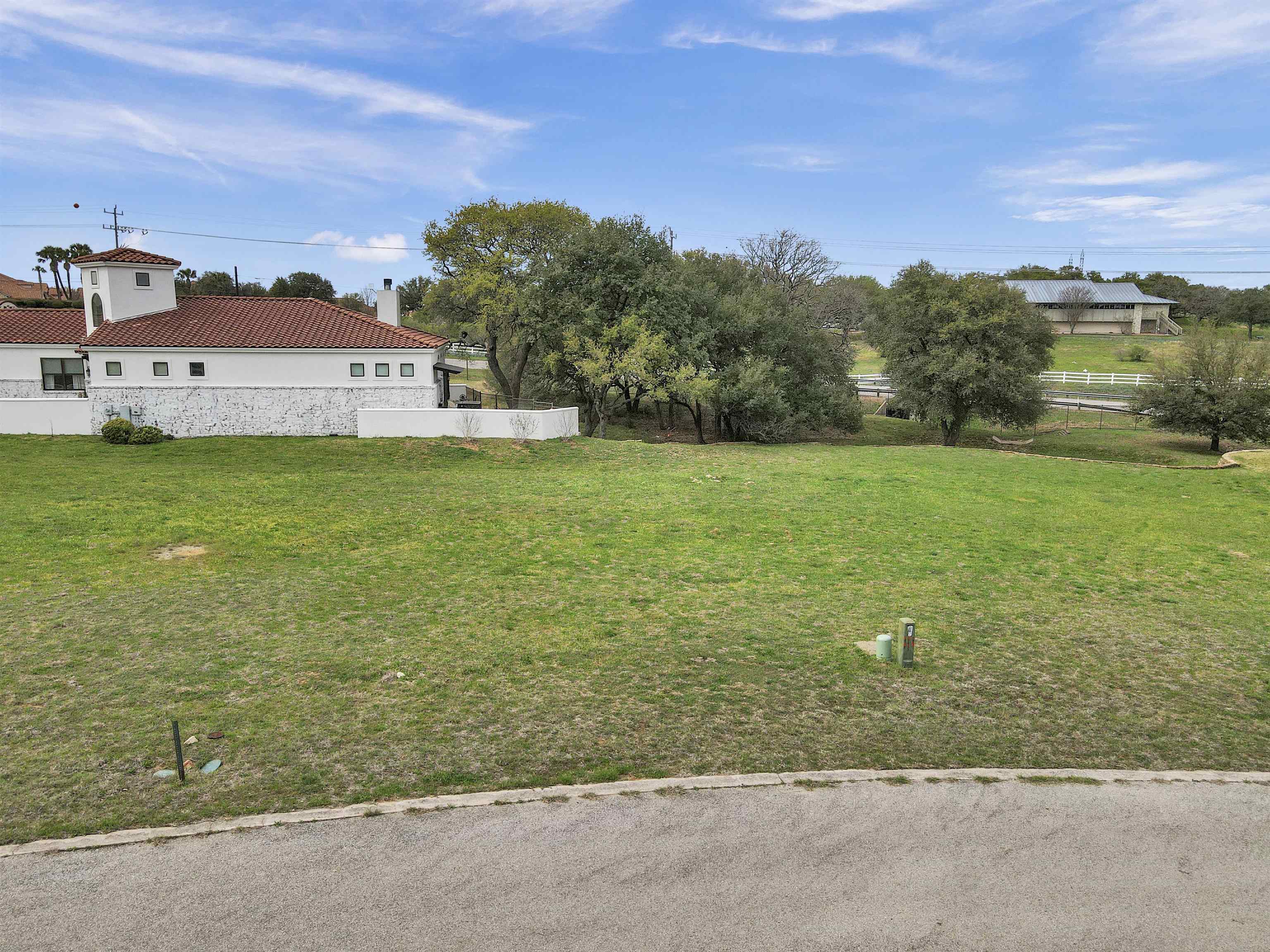 a view of a big house with a big yard