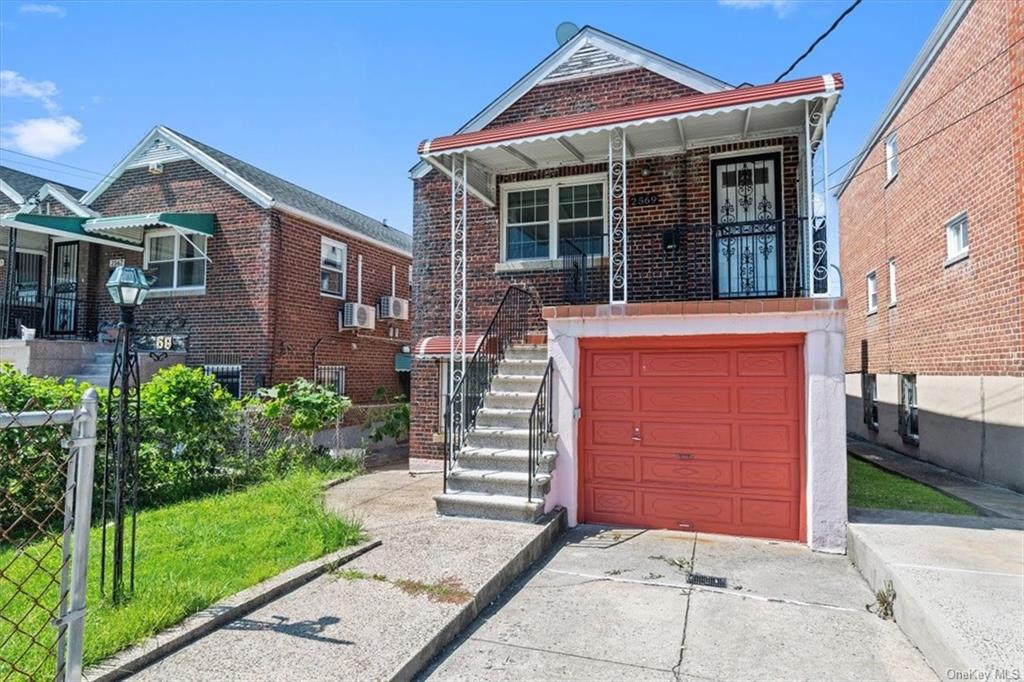 View of front facade featuring a garage