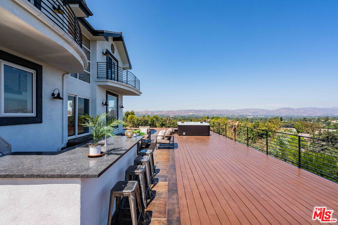 a view of a balcony with lake view and mountain view