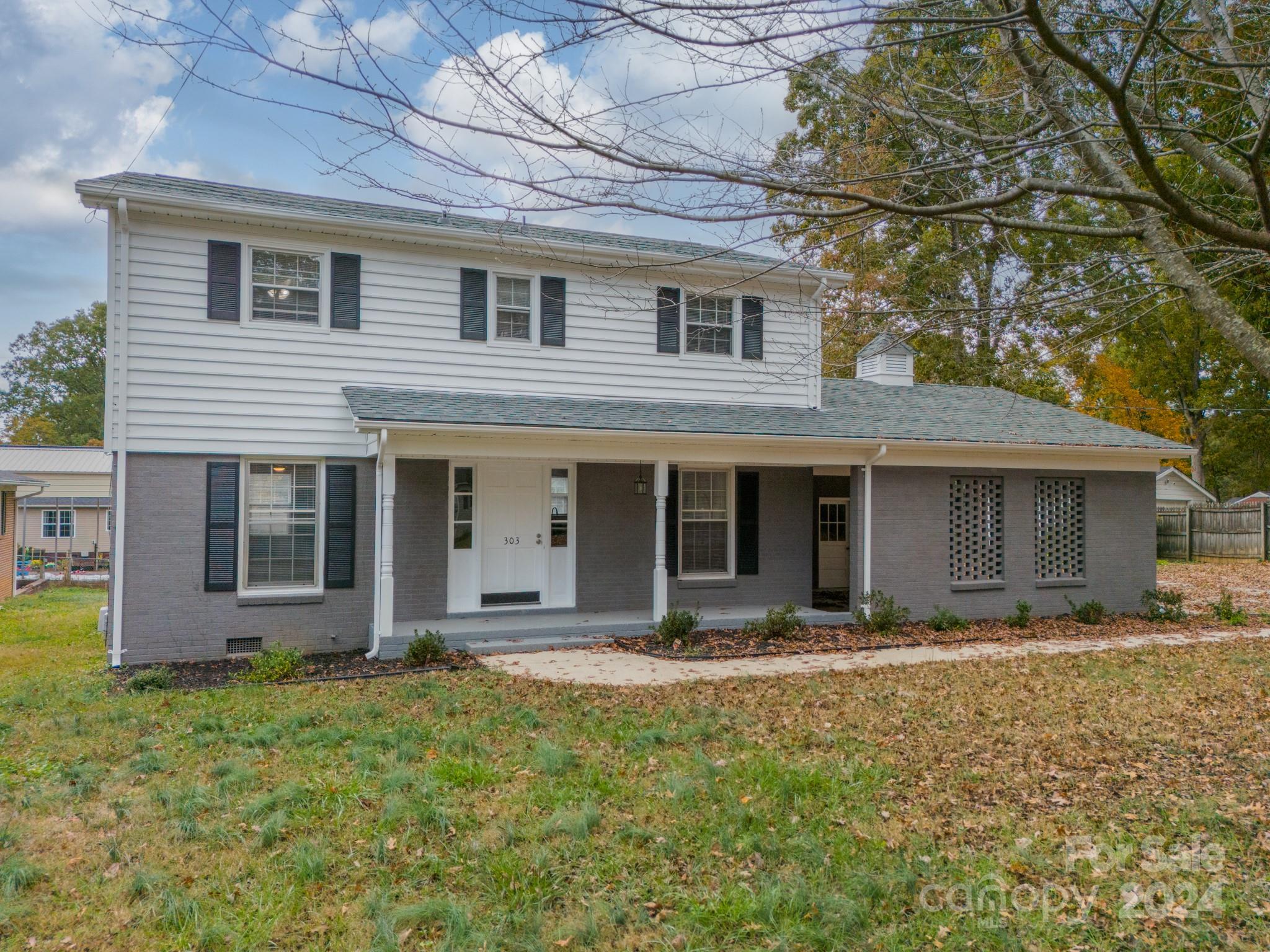 a front view of a house with yard