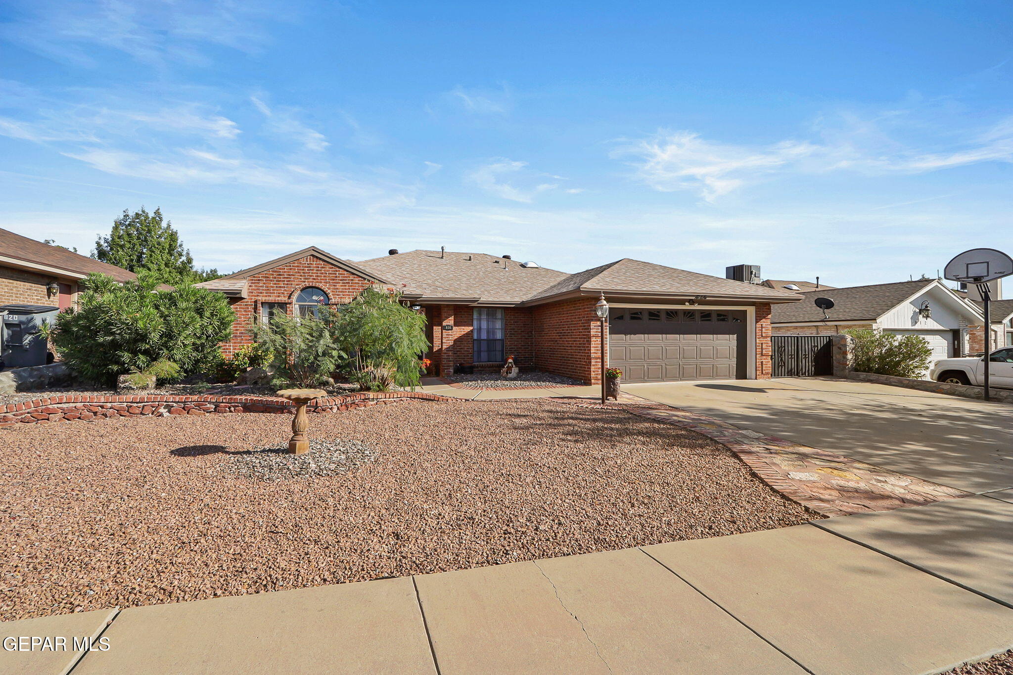 a view of a house with a yard and fence