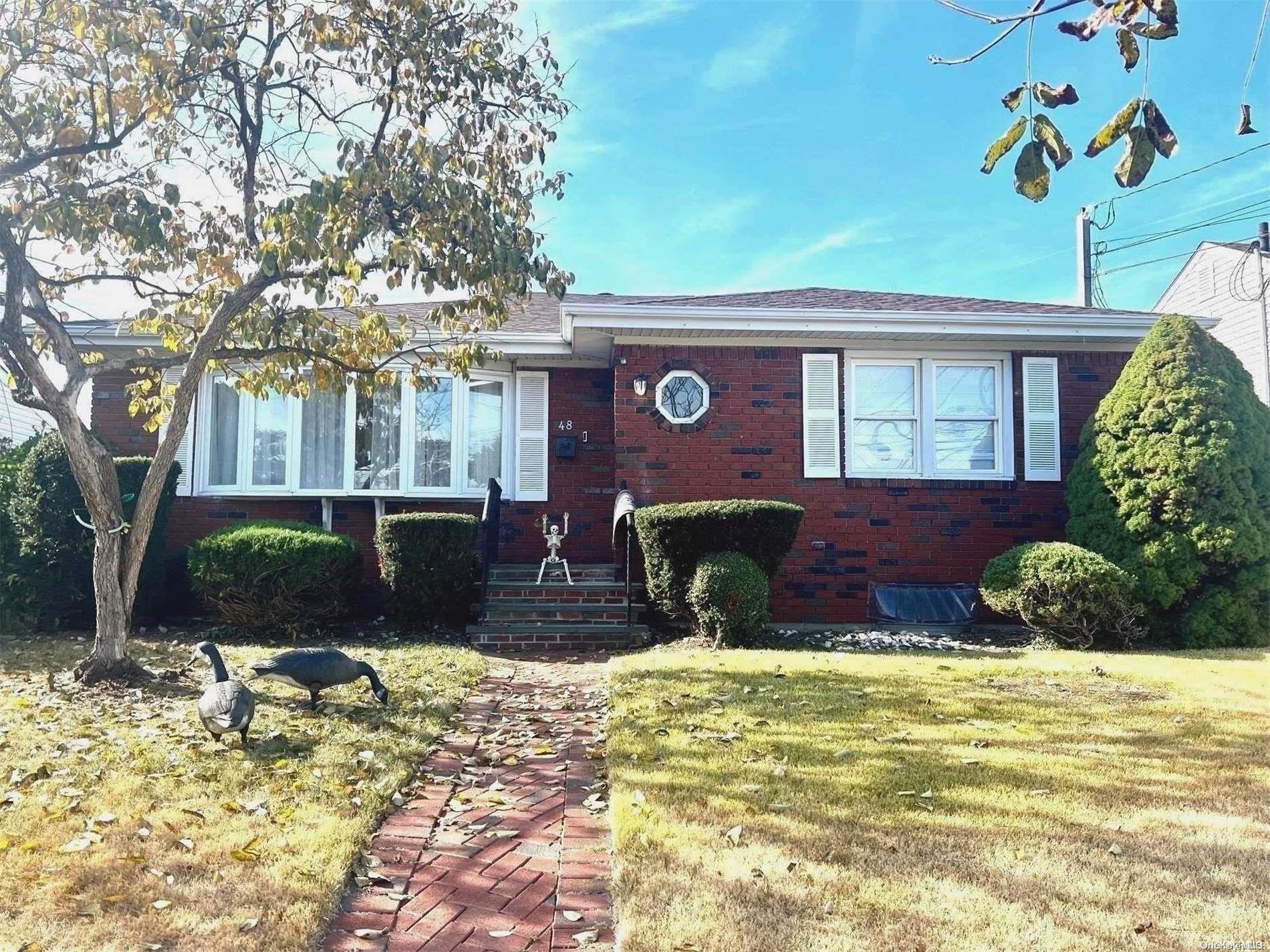 a view of a house with backyard porch and sitting area