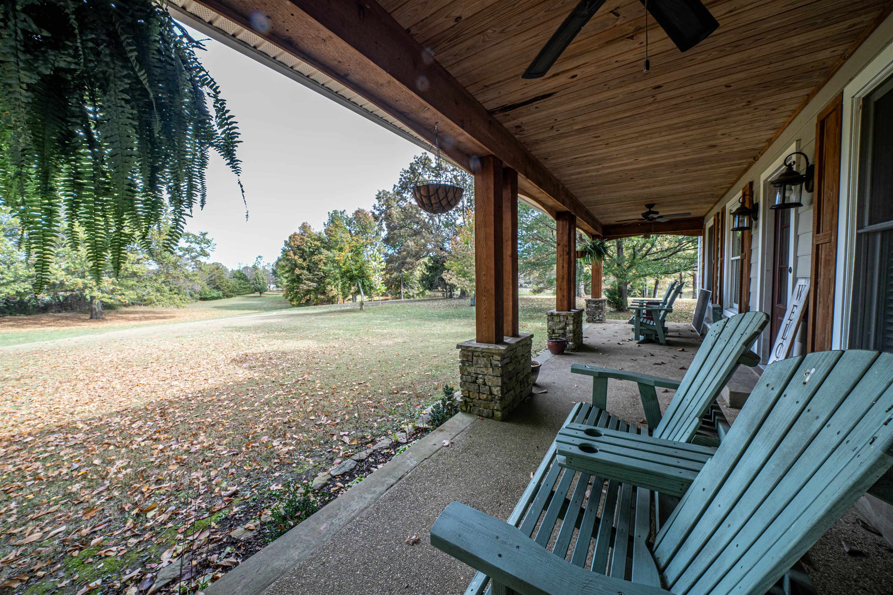 a view of balcony with wooden floor and outdoor seating