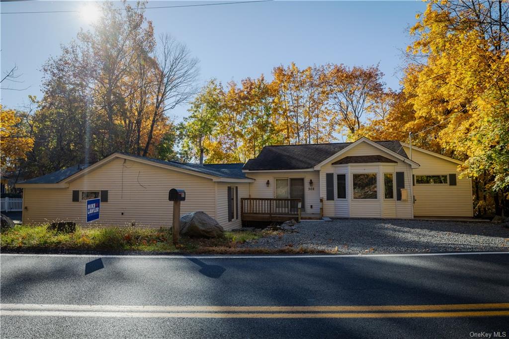 a house that has a tree in front of it