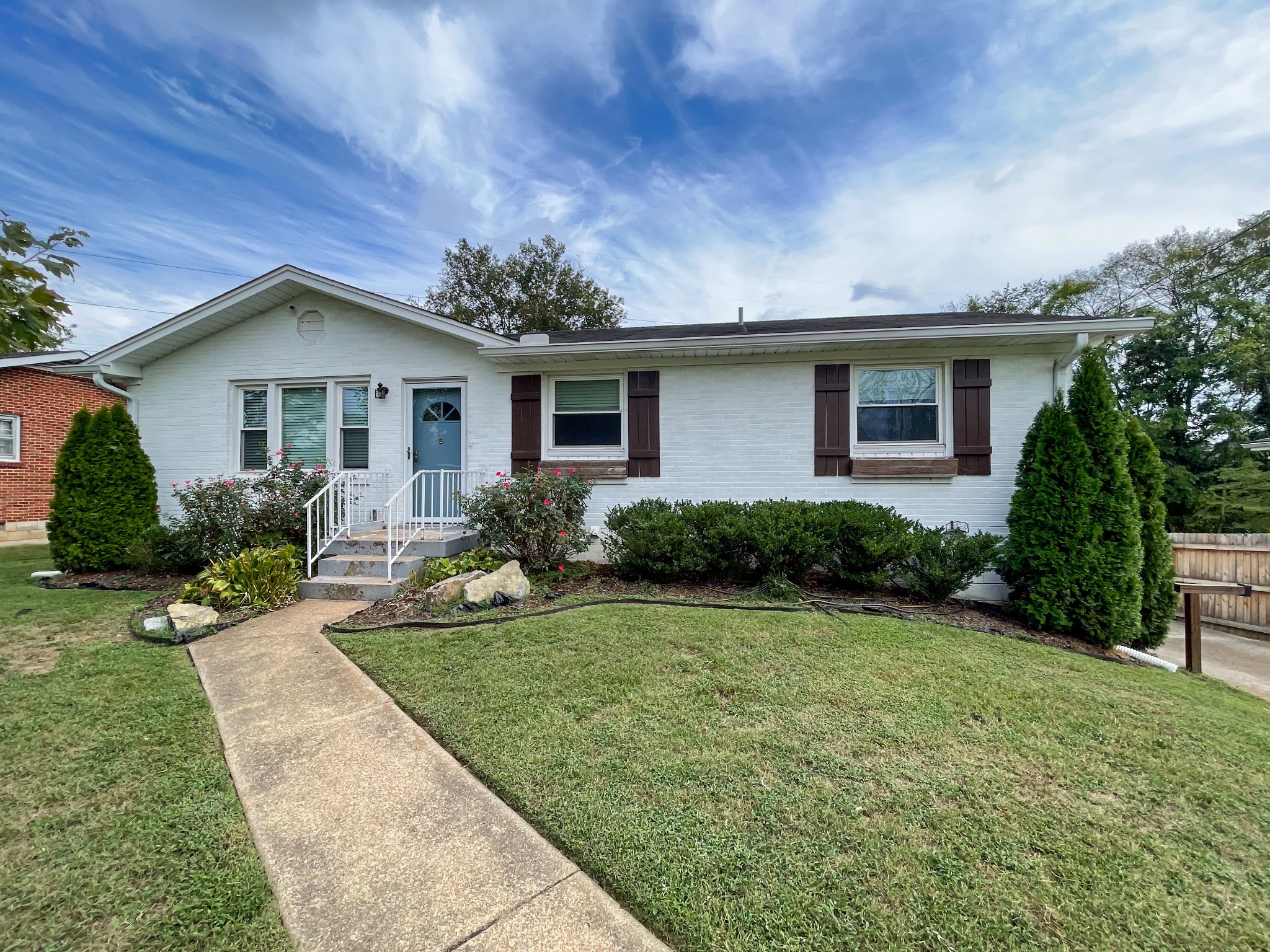 a front view of a house with yard