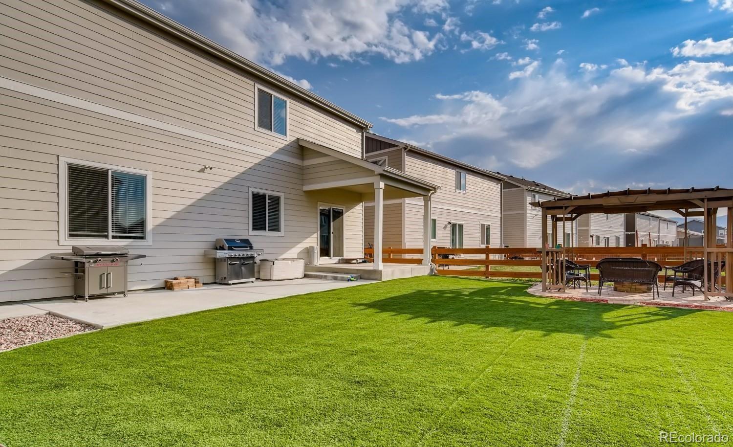 a front view of house with yard and seating area