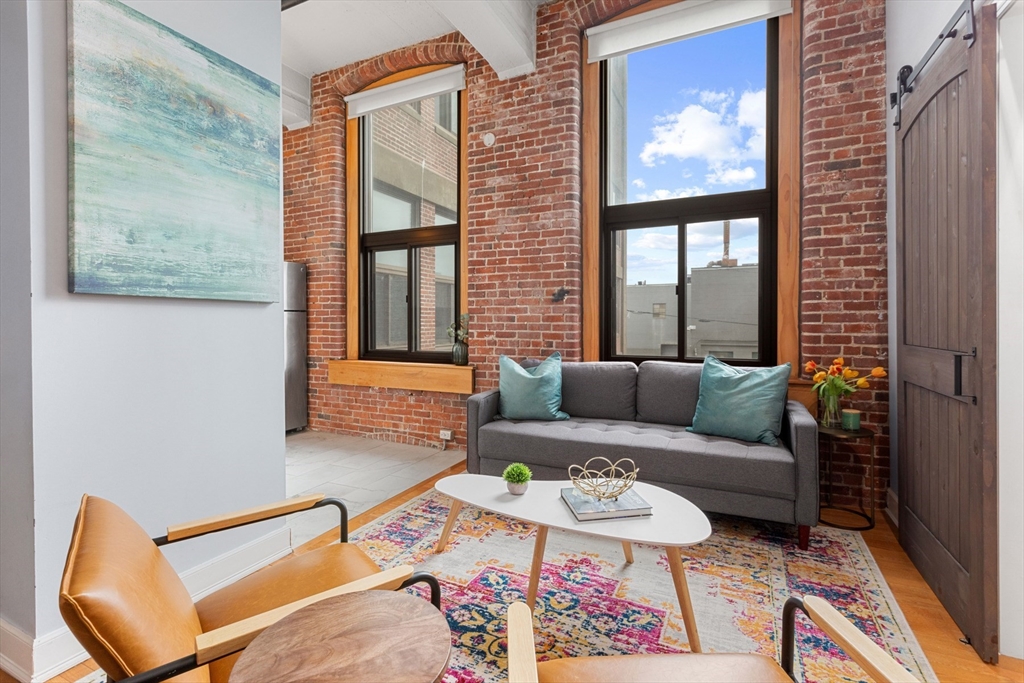 a living room with furniture and a window