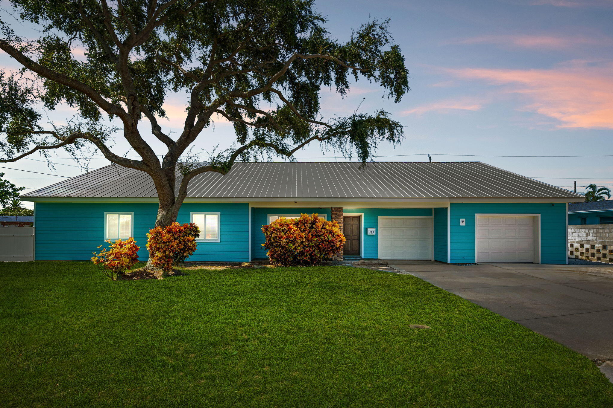 a front view of house with yard and outdoor seating