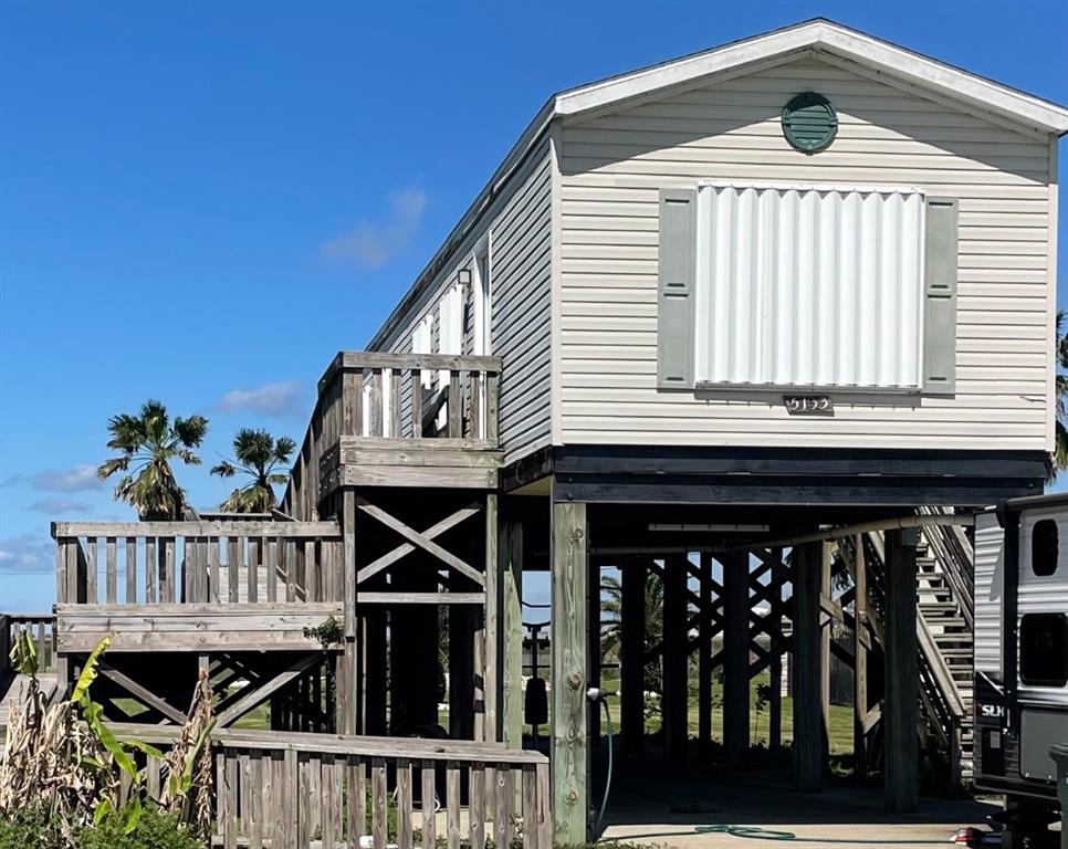 a front view of a house with deck