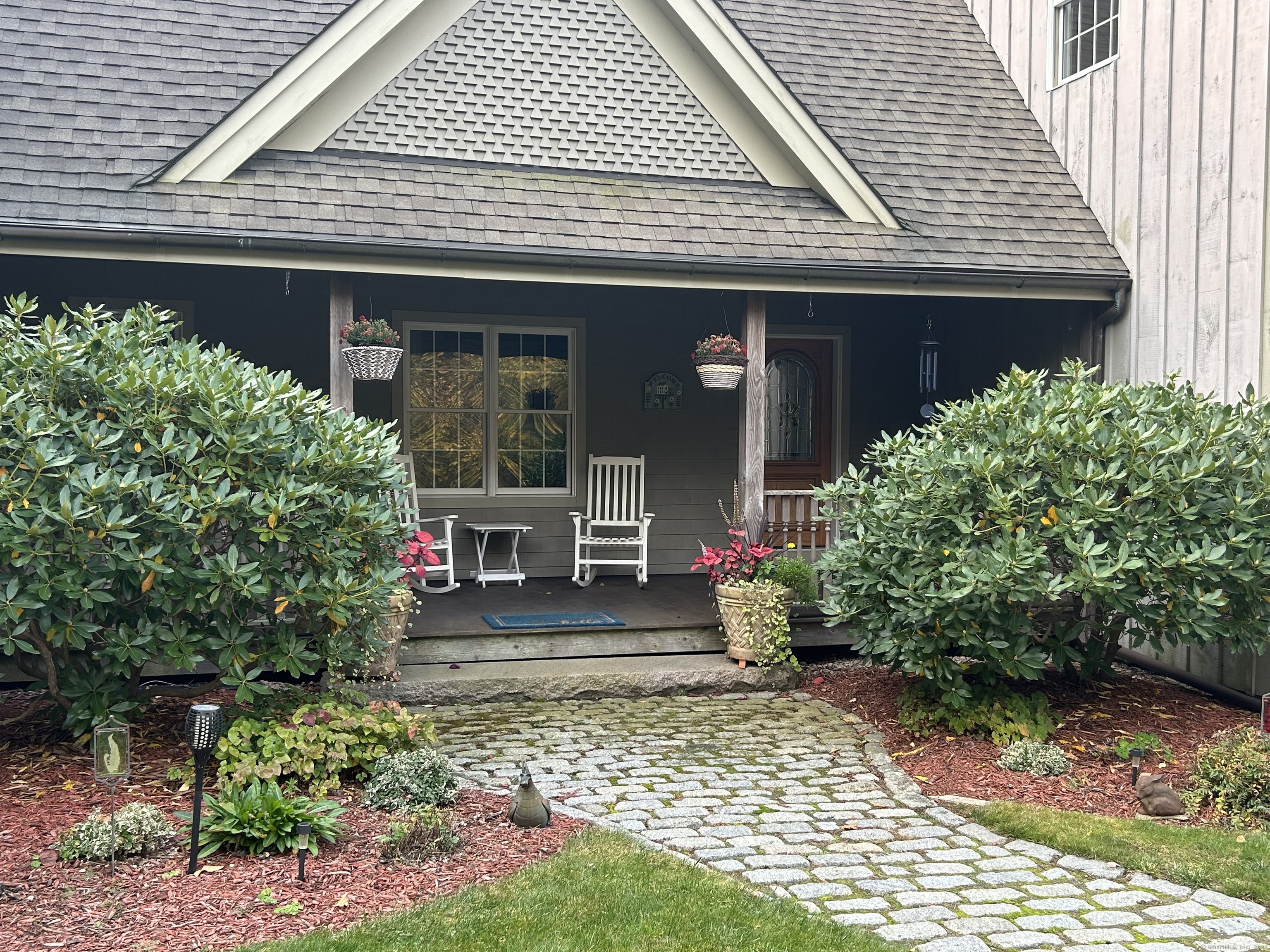 a front view of a house with garden