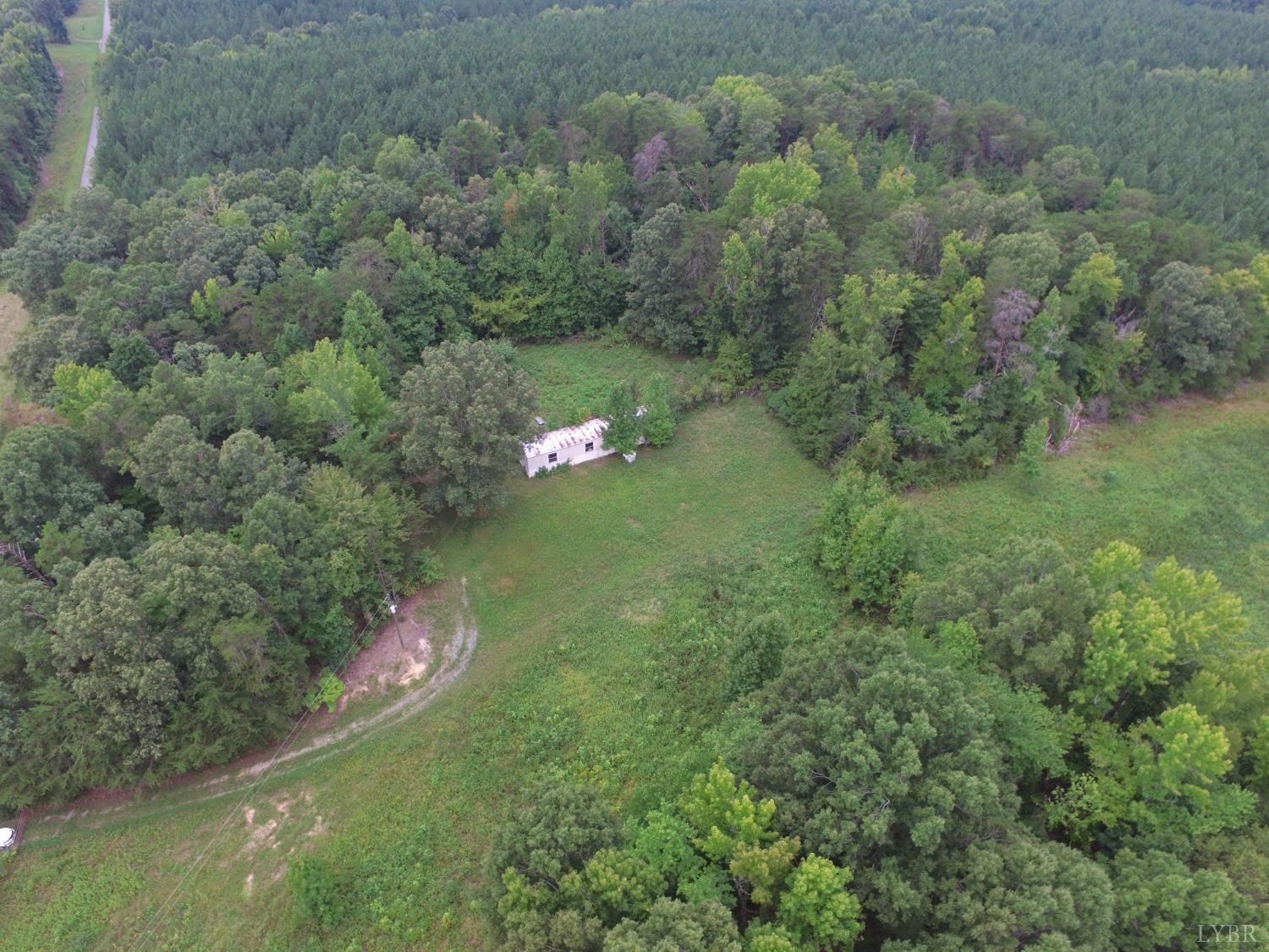 a aerial view of a house with a yard