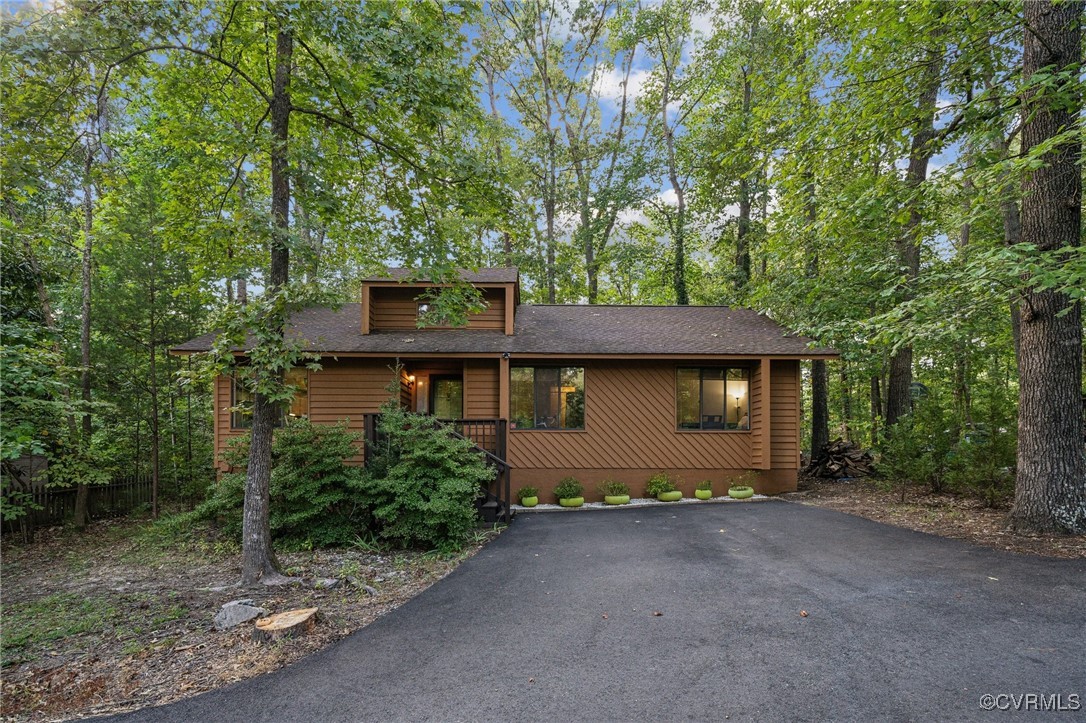 a view of a house with large trees