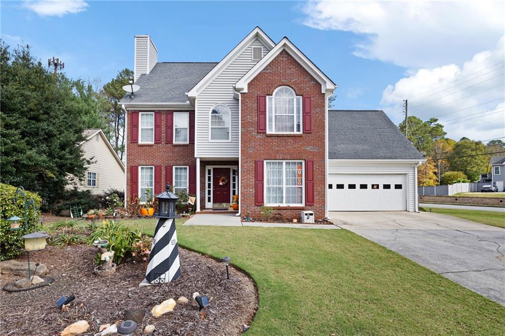 a front view of a house with a yard