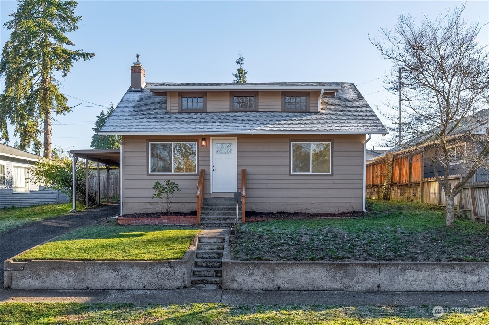 a front view of a house with a yard