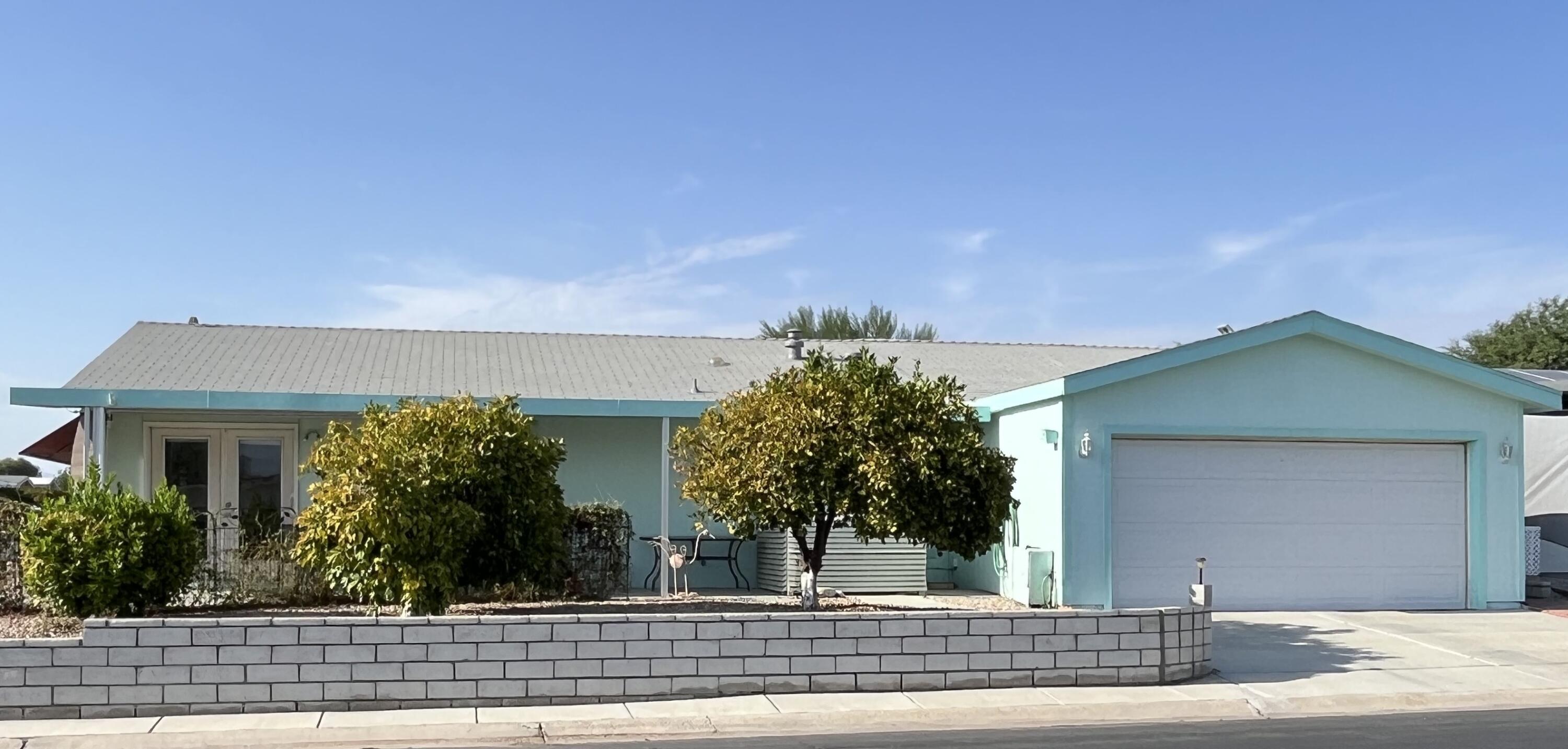 front view of a house with a garden