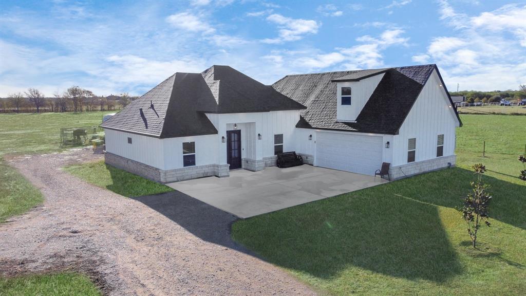 a aerial view of a house with a yard