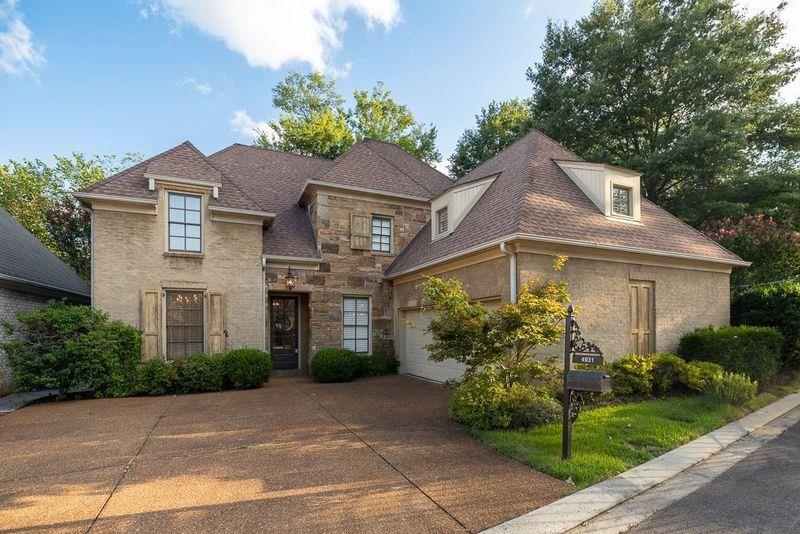 View of front of property with a garage