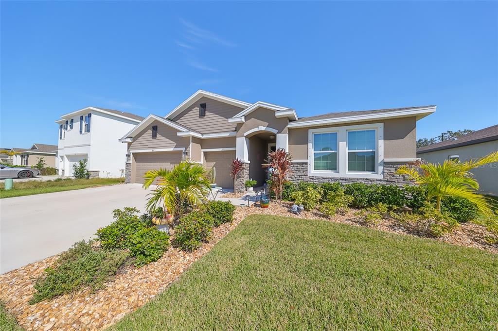 a front view of a house with a yard