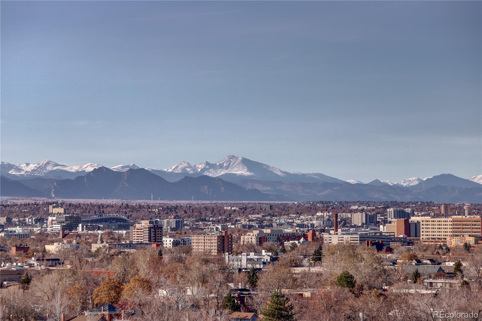 an aerial view of residential house and mountain view