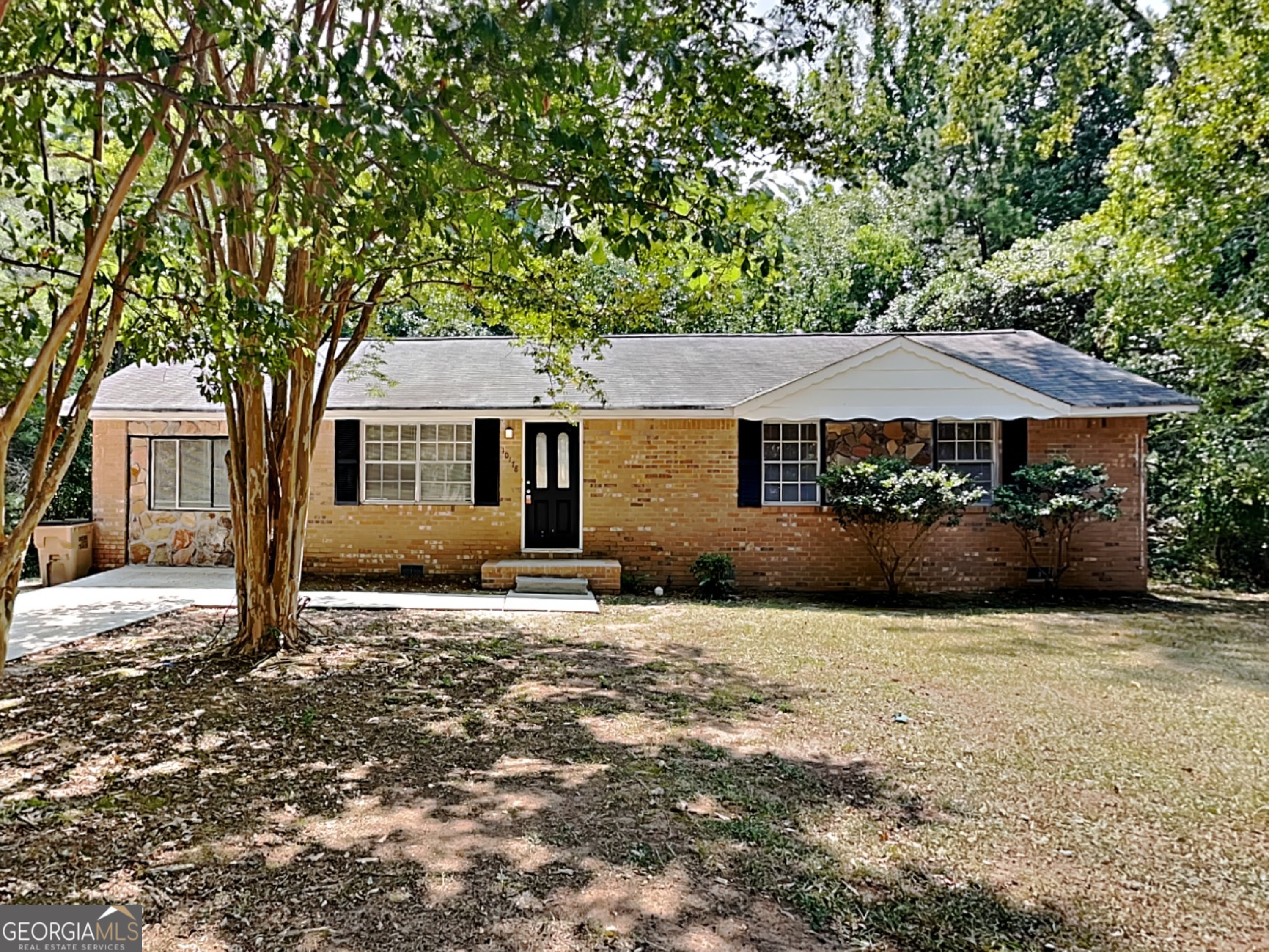 a front view of a house with yard