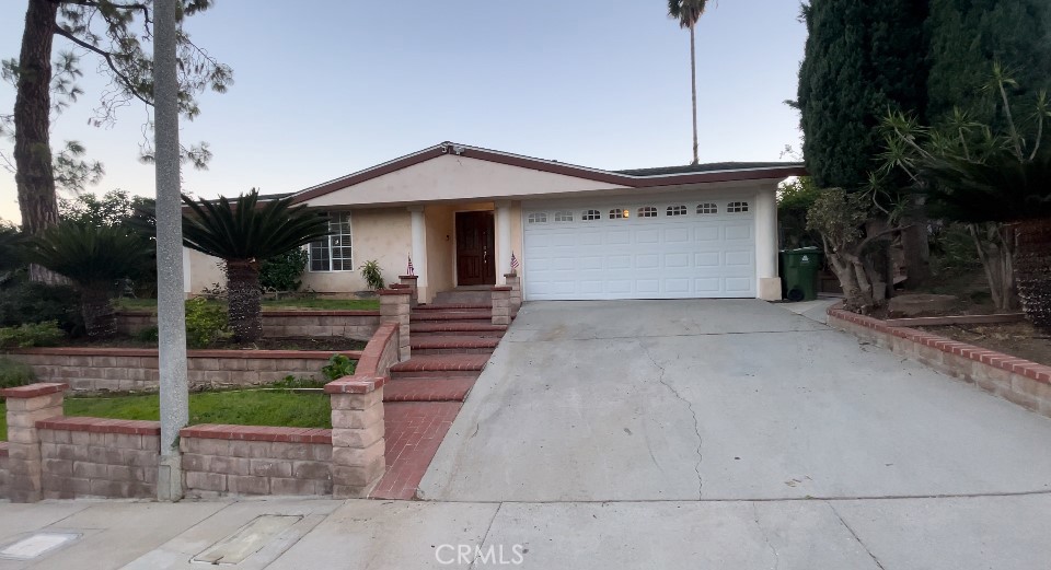 a front view of a house with garage